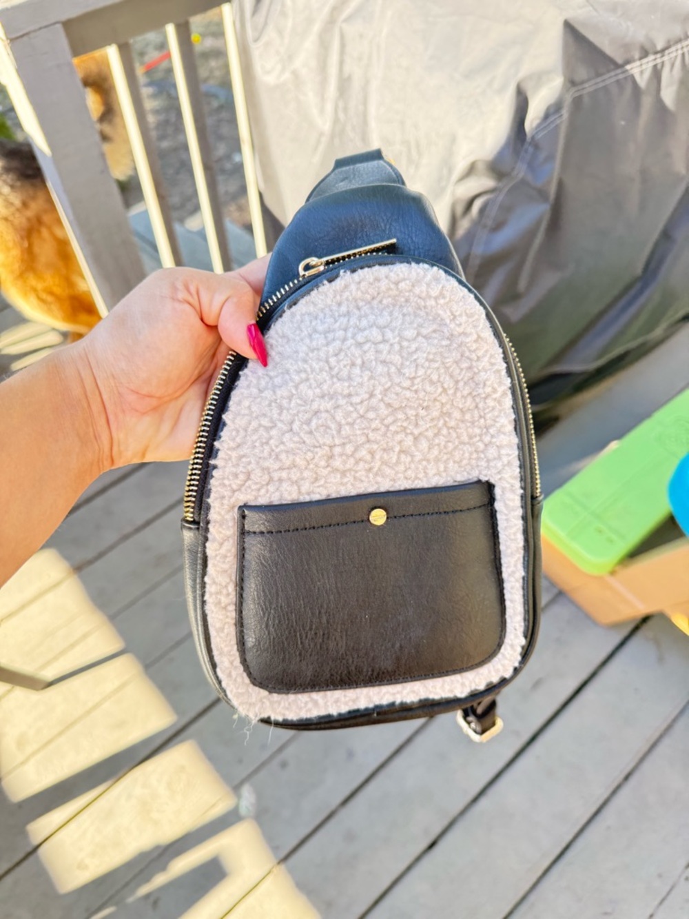 Anthropologie Black and Cream Sherpa Front Sling Backpack